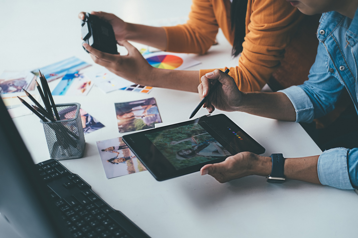 Advertising Agency Designers Brainstorming on Office Desk